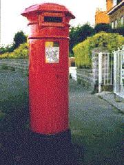 Cylindrical red pillar box.